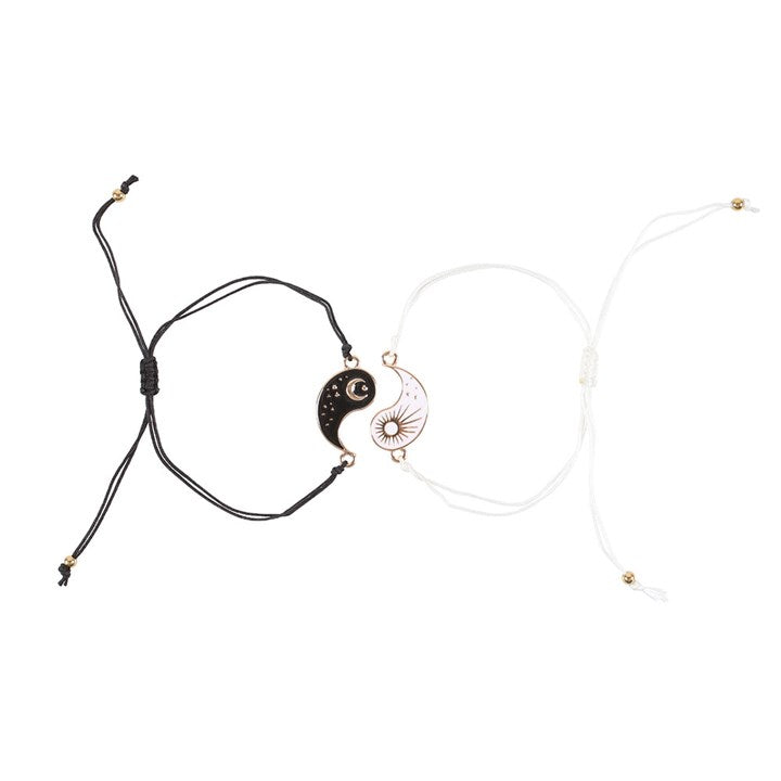 Yin and Yang friendship bracelets with sun and moon charms in nickel-free stainless steel.