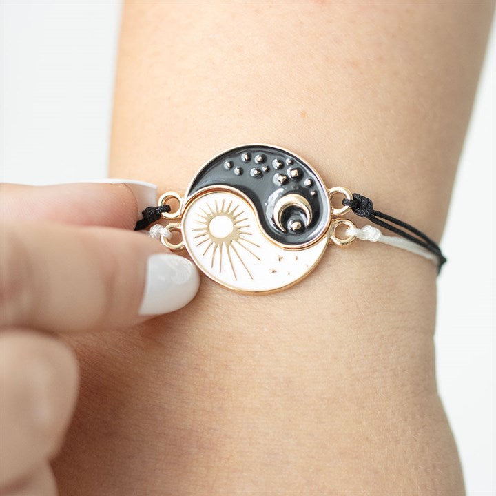 Yin and Yang friendship bracelets with sun and moon charms in nickel-free stainless steel.