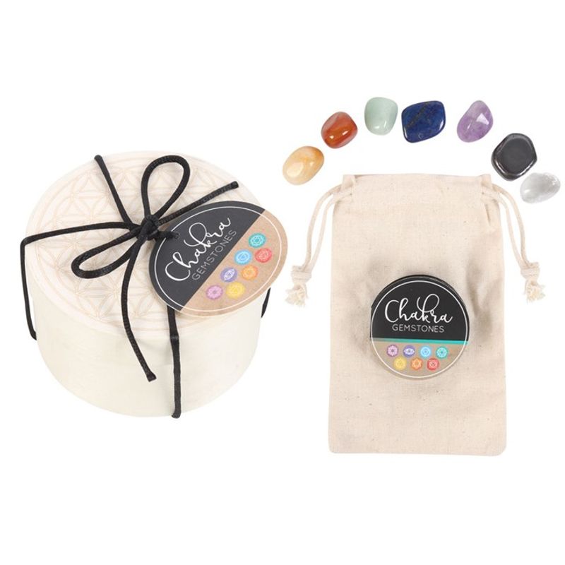 Chakra Gemstone Crystal Gift Set with 7 tumbled crystals, a wooden Flower of Life gift box, and a cotton drawstring bag for storage.