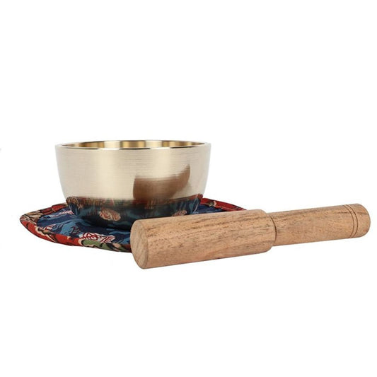 A handcrafted 9cm Brass Singing Bowl featuring a traditional Buddha design. Includes a fabric mat and wooden striker for meditation, sound healing, and energy clearing, producing soothing tones to enhance mindfulness and relaxation.