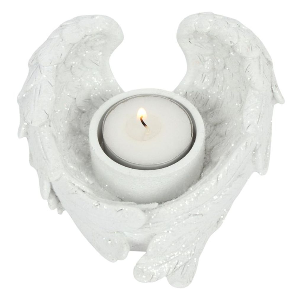 Glitter Angel Wing Candle Holder, designed for tealights or small votive candles, featuring sparkling glitter dust for a shimmering effect in the candlelight.