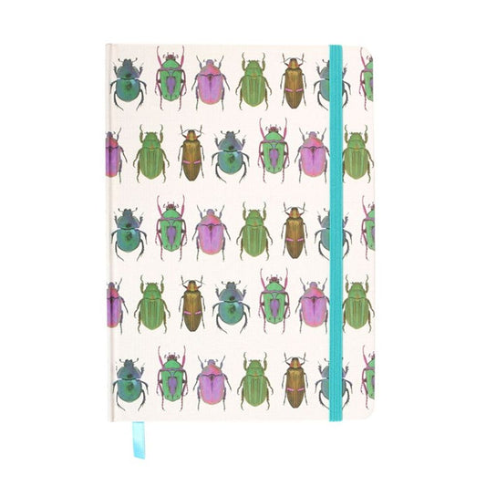 A5 notebook with colourful beetle print design, gold foil pages, and turquoise ribbon marker, symbolizing resilience and transformation.