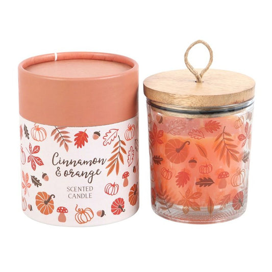 Cinnamon & Orange Scented Candle with leaf and pumpkin design, wooden lid, and matching cylinder box, offering a warm, cozy fragrance with a 30-hour burn time.