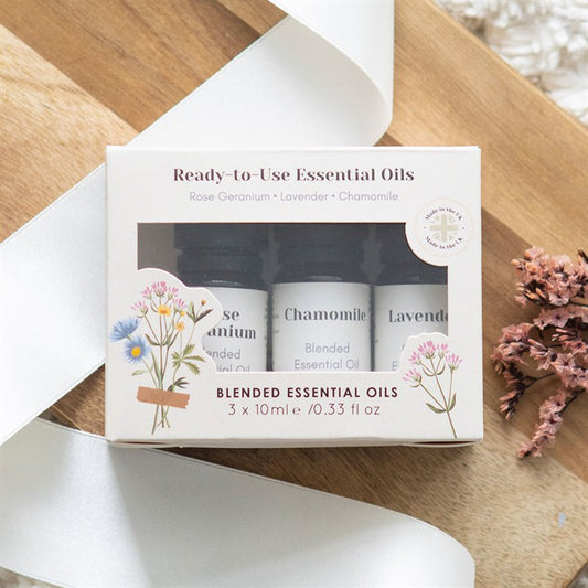 Set of 3 floral essential oils in rose geranium, lavender, and chamomile, perfect for use in oil burners, diffusers, or relaxing baths.

