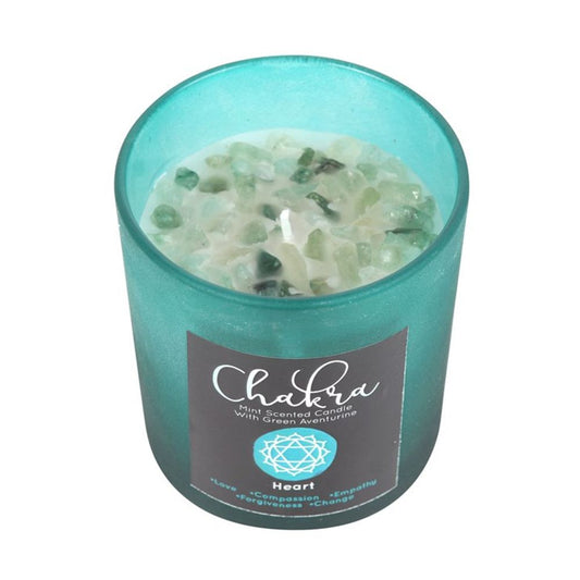 Heart Chakra mint-scented candle in green frosted glass with metallic lid, featuring green aventurine crystal chips for chakra alignment, approximate burn time 25 hours.