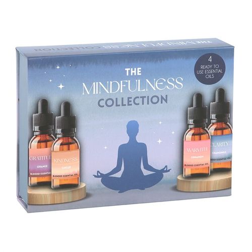 Set of four mindfulness-themed essential oils with dropper lids, in scents including orange, ginger, cinnamon and chamomile.

