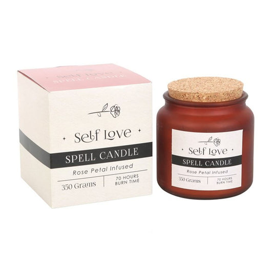 A Rose Petal Infused Self Love Spell Candle in a frosted glass jar with a cork lid. Infused with real rose petals, this wax candle is designed to attract love, confidence, and gratitude, offering a burn time of 70 hours. Ideal for manifestation rituals and home decor.