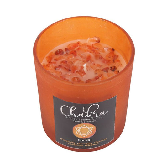 Sacral Chakra orange-scented candle8 in orange frosted glass with metallic lid, featuring carnelian crystal chips for creativity and passion, approximate burn time 25 hours.