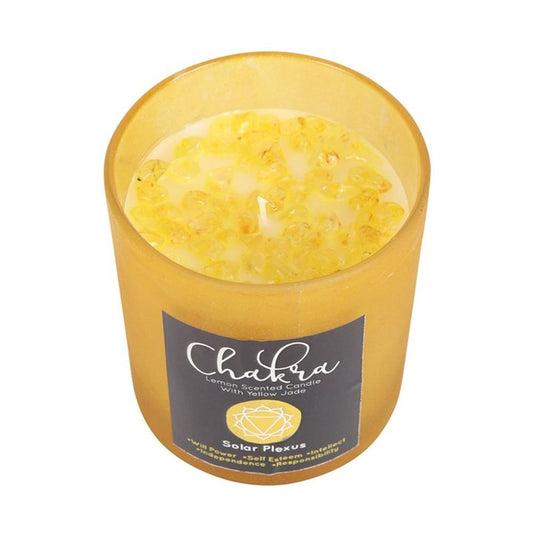 Solar Plexus Chakra Lemon Crystal Chip Candle in yellow frosted glass with yellow jade chips, metallic lid, and 25-hour burn time for confidence and balance.