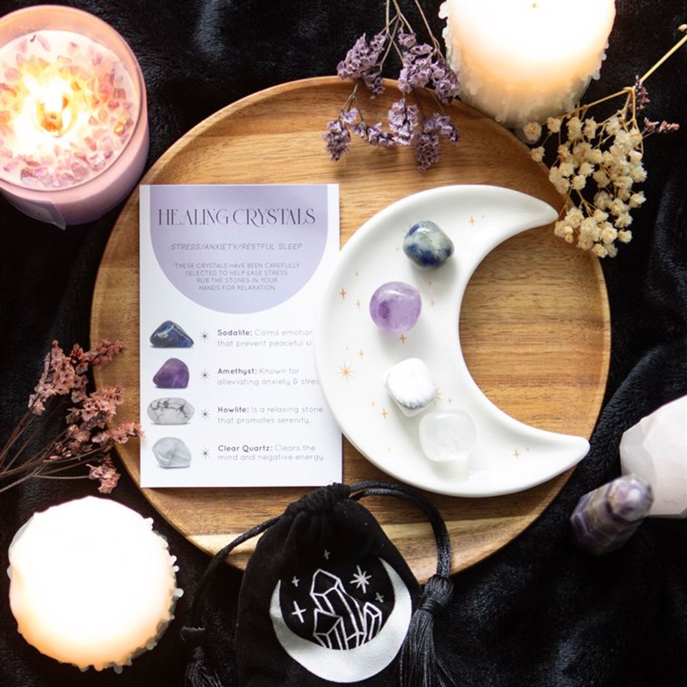 Stress Healing Crystal Set with Sodalite, Amethyst, Howlite, and Clear Quartz tumblestones, crescent moon trinket dish, and matching drawstring bag.