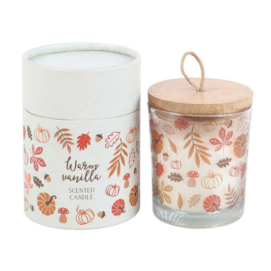 Warm Vanilla scented candle with a leaf and pumpkin design, wooden lid, and matching cylinder box packaging. Vegan wax, 30-hour burn time. Perfect for fall gifting.